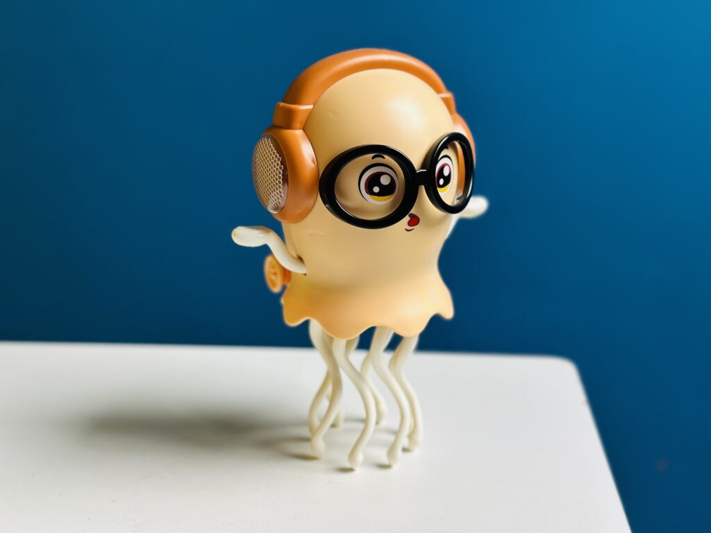 "Magical Dancing Jellyfish Toy floating and spinning in water, colorful LED light aquatic toy for kids and home decoration"